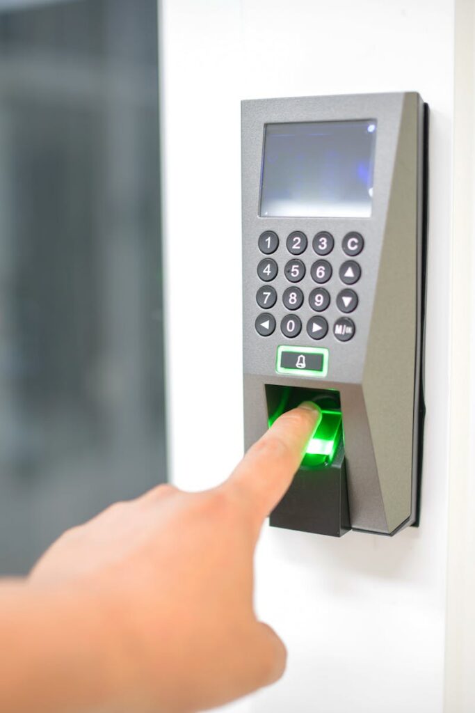 pexels photo 17155842 17155842 A person uses a fingerprint scanner for secure entry in a business setting.
